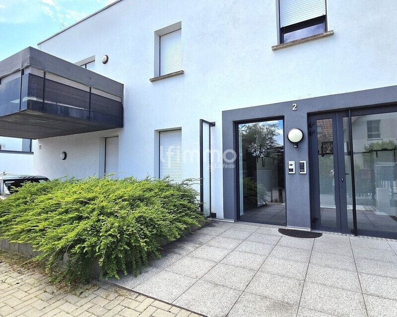 Appartement 3 pièces en rez-de-jardin - Façade 1